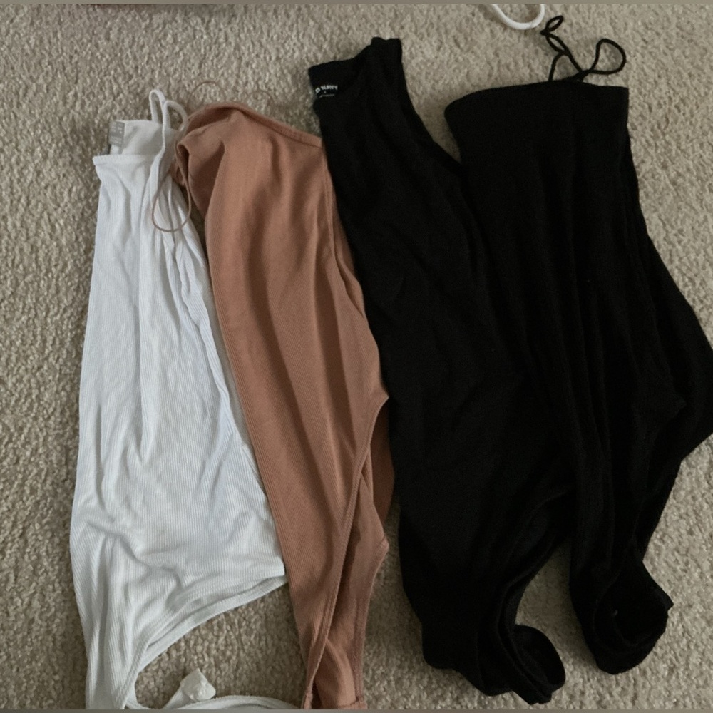 Set of Black, White, and Tan Bodysuits